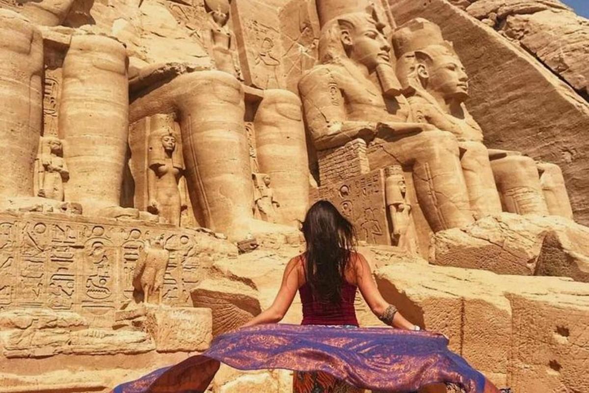 a woman is sitting in front of anaraoh