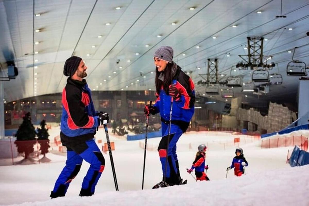 a man and a woman on skis in the snow
