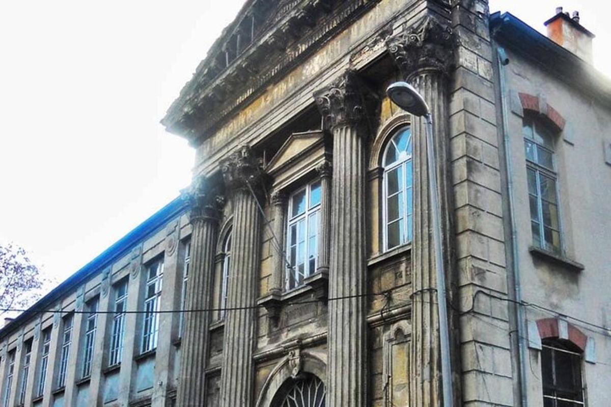 an old building with a street light in front of it