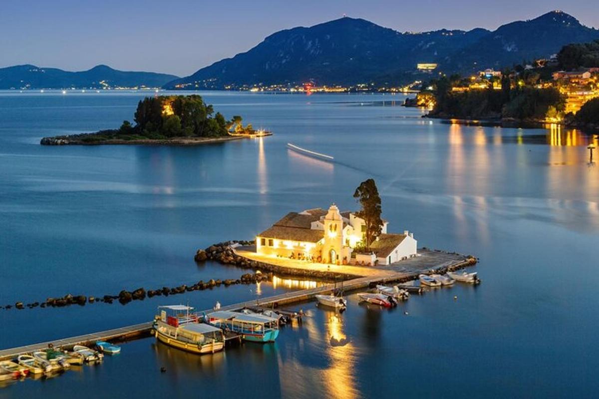an island in a large body of water with boats