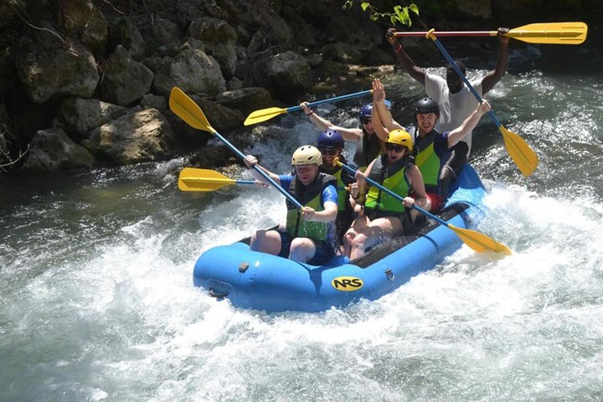 a group of people in a raft on a river