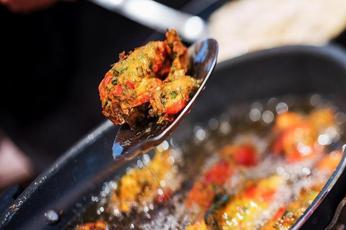 a spoon full of food in a pan