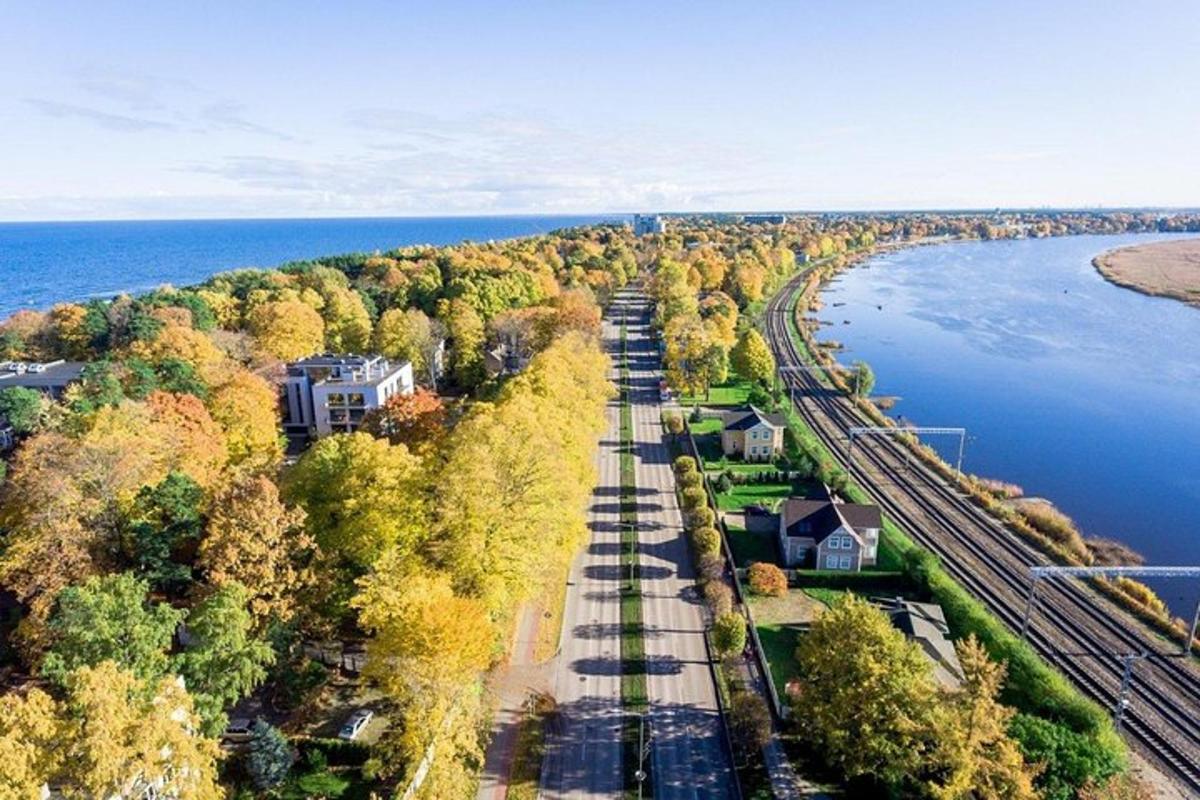 an aerial view of a house next to the water