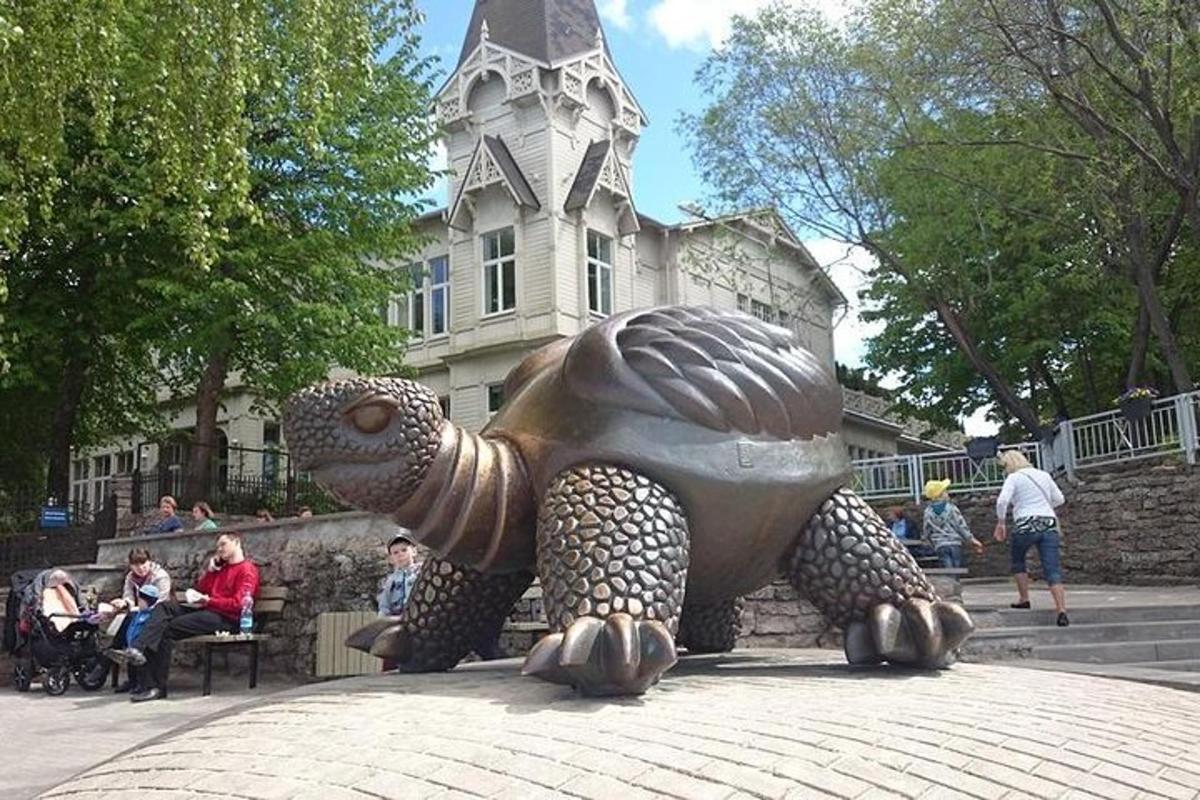 a statue of a turtle in front of a building