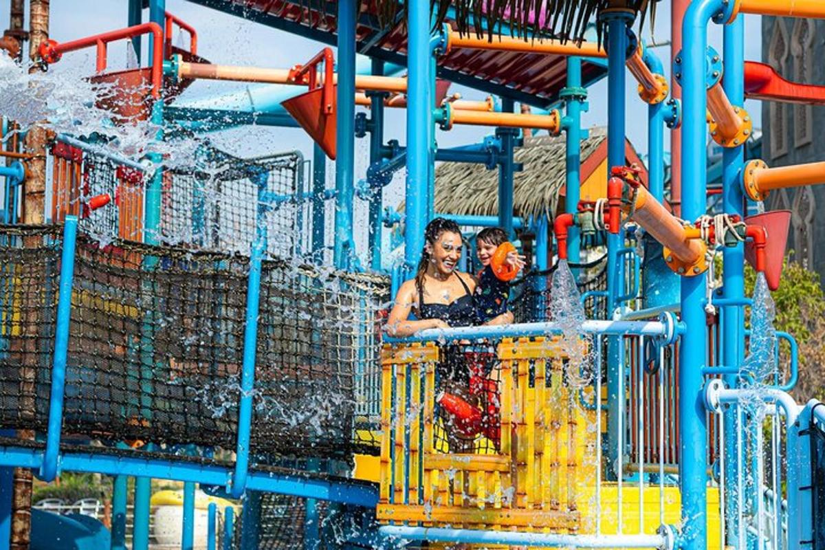 a woman is playing in a water park