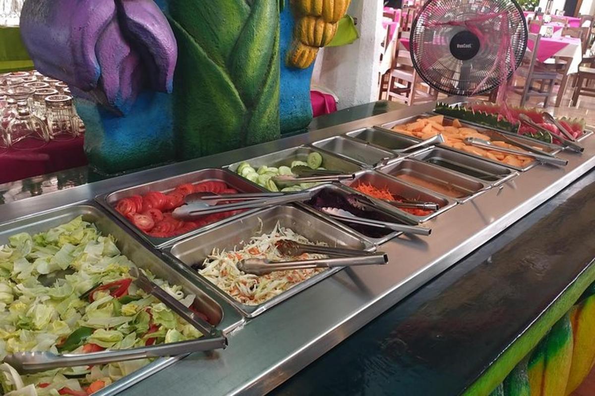 a buffet line with many trays of food on it