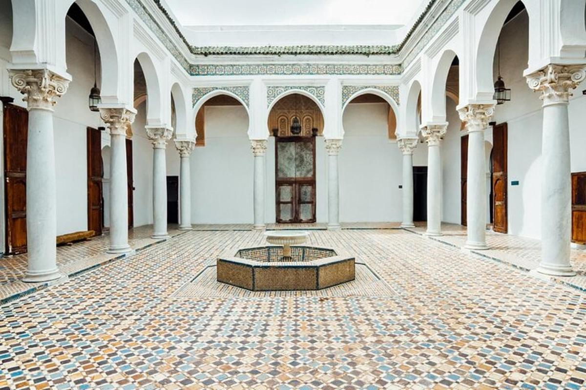 a room with a fountain in the middle of a building