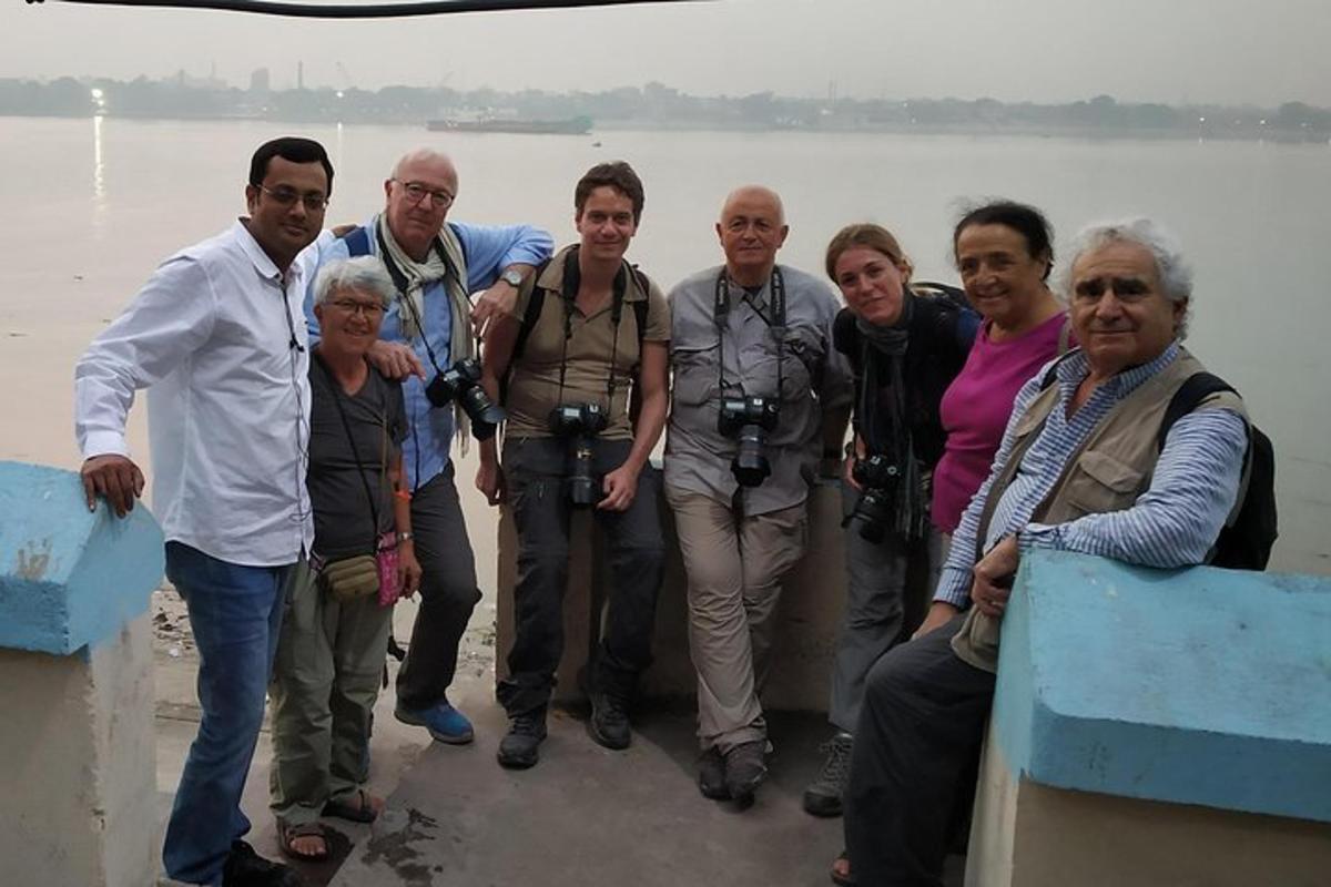 a group of people posing for a picture on a boat