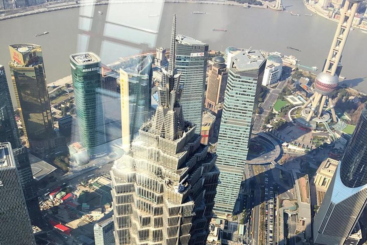 an aerial view of a city with tall buildings