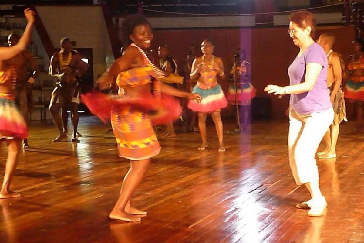 a group of people dancing on a dance floor