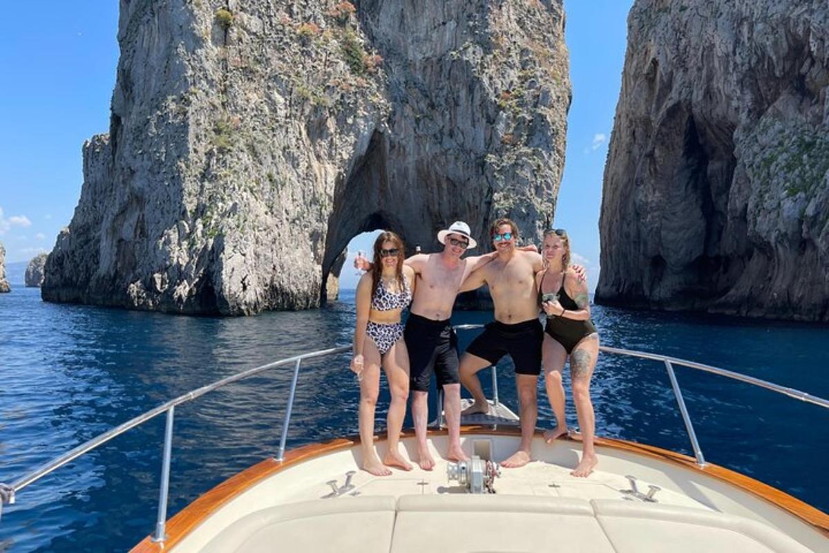 a group of people standing on the front of a boat