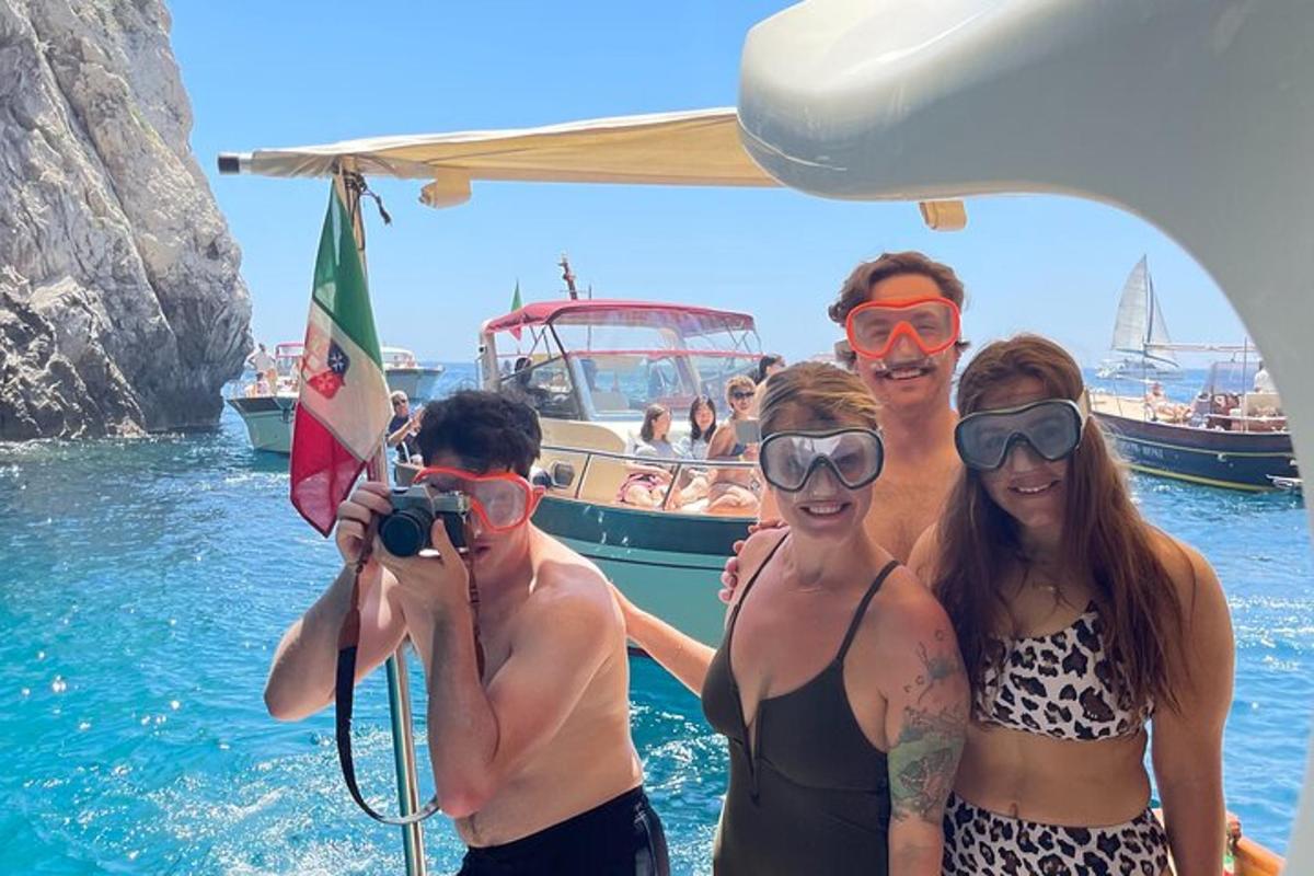 a group of people on a boat in the water