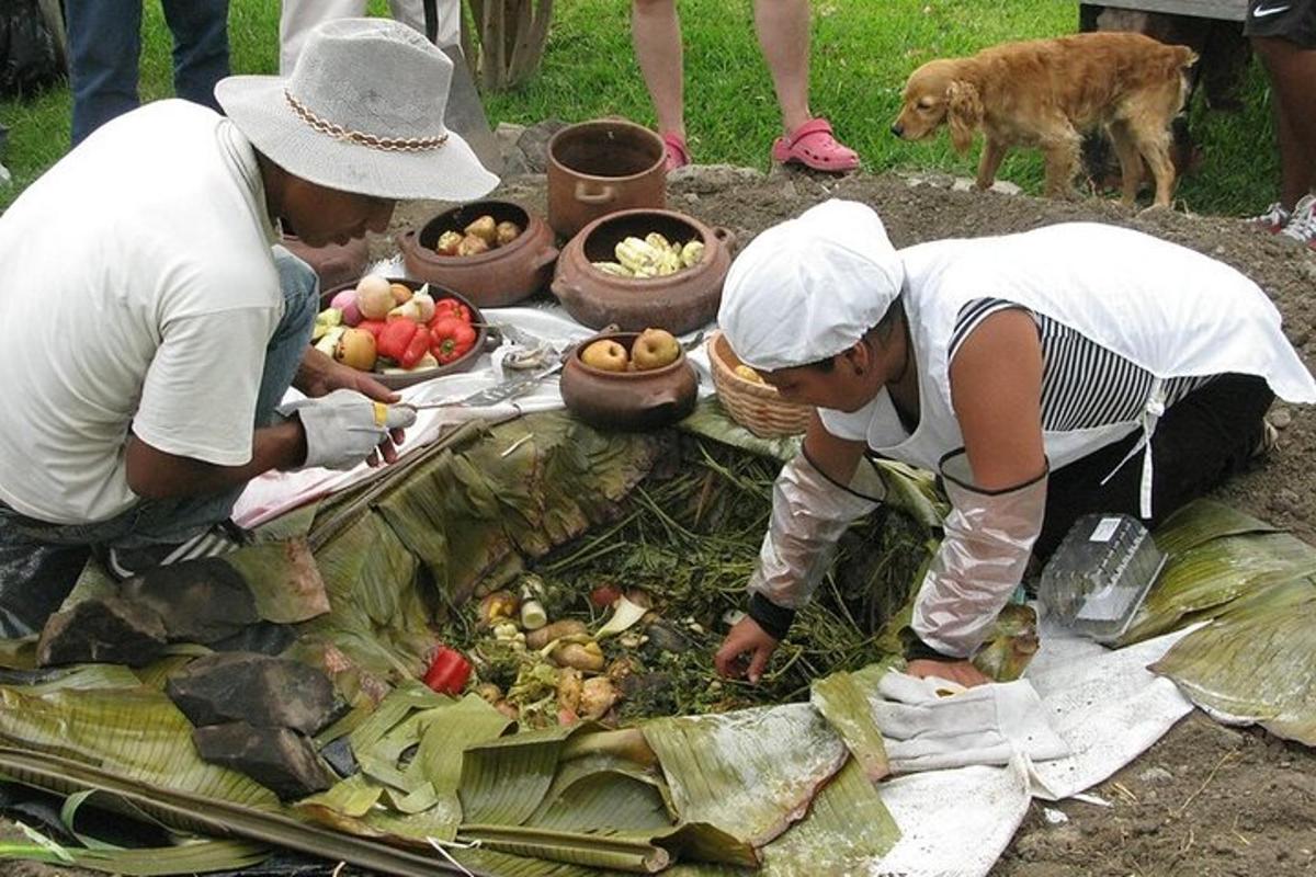 deux personnes préparant des légumes sur une table avec un chien