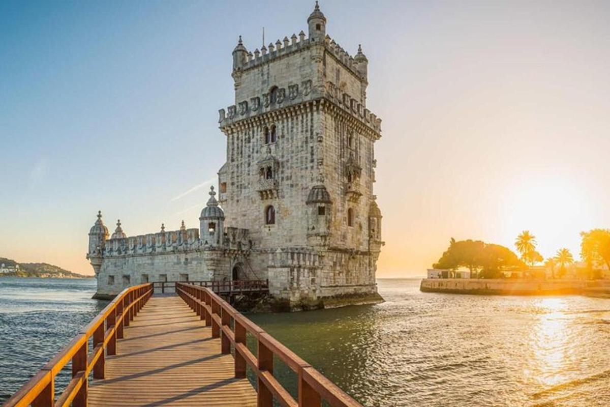 a lighthouse on the water next to a bridge