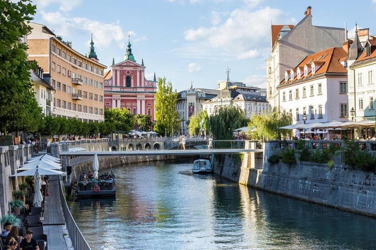 a bridge over a river in a city with buildings