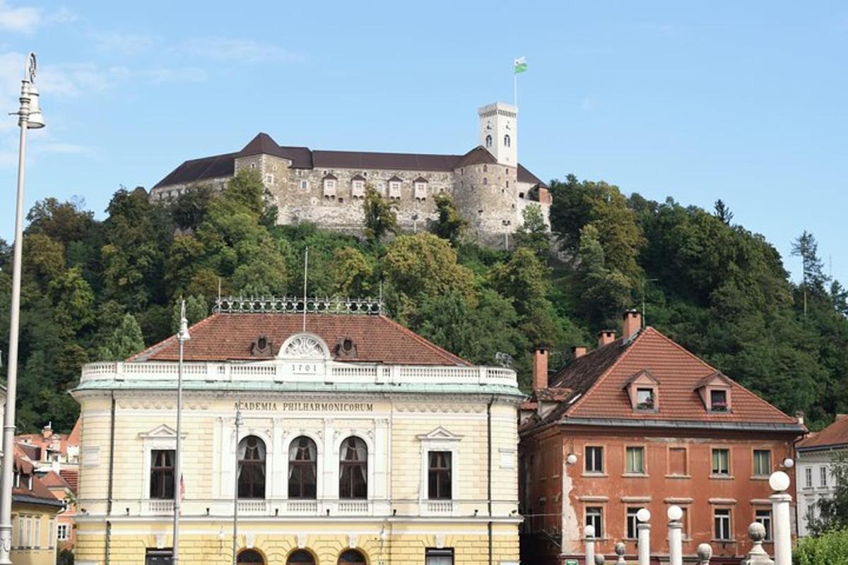 a building with a castle on top of a hill