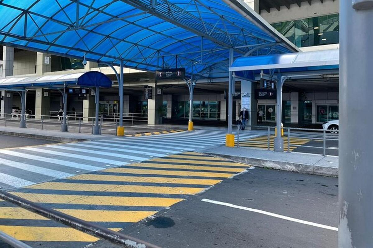 an empty train station with a blue roof