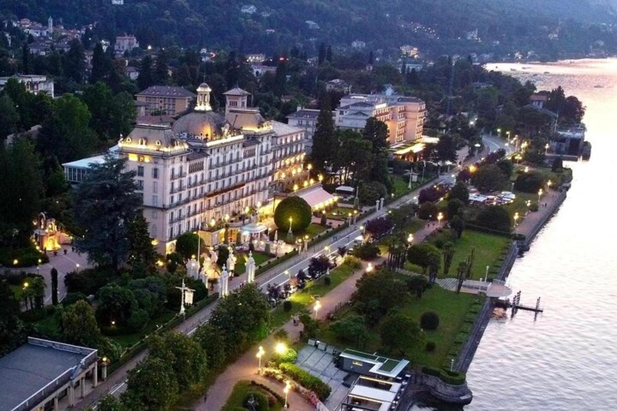 an aerial view of a large building next to the water