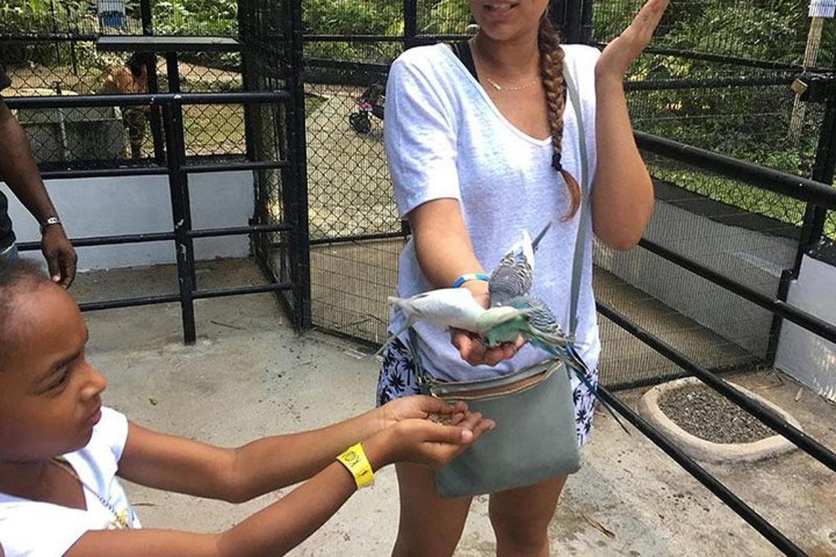 a woman holding a baby in a bag