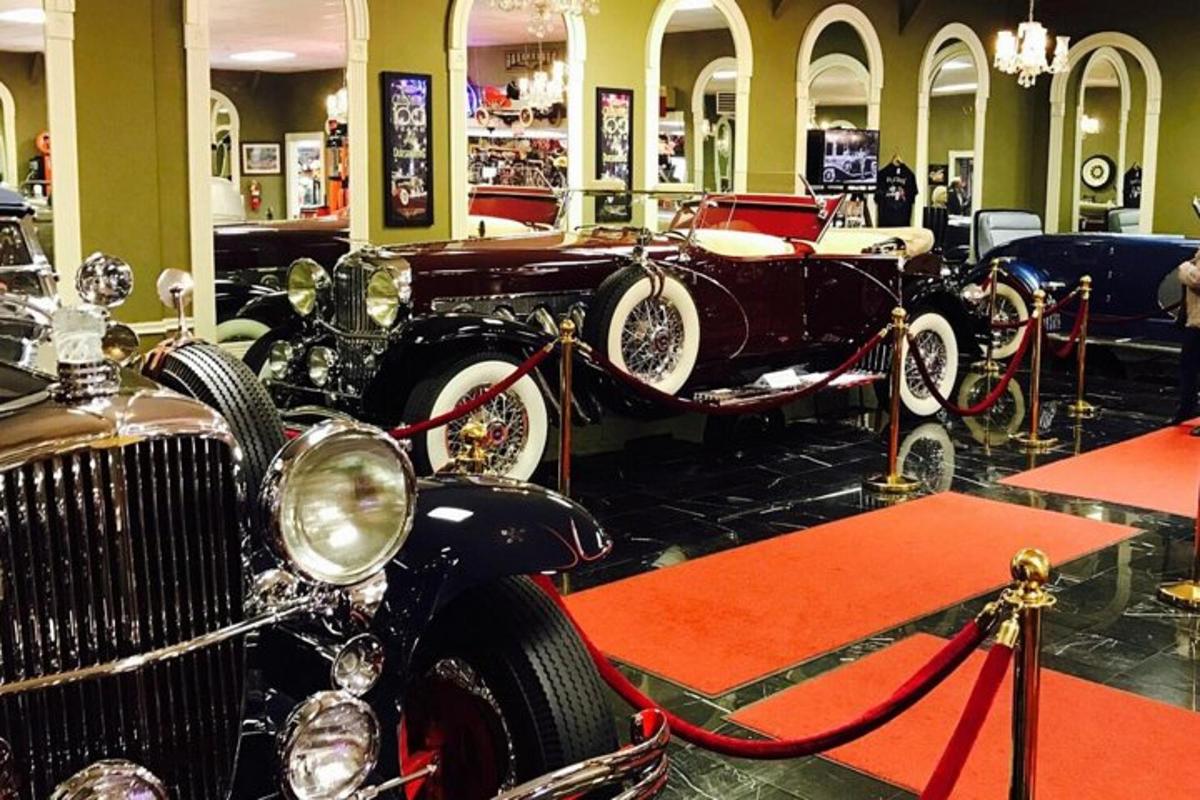 a group of antique cars on display in a store