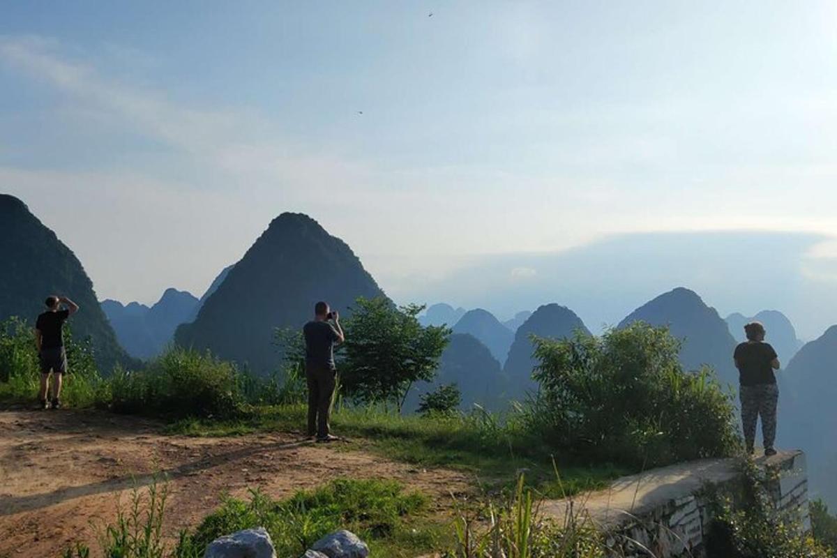 a group of people taking pictures of mountains