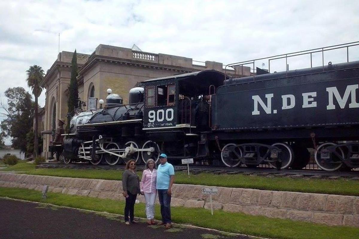 a group of people standing in front of a train