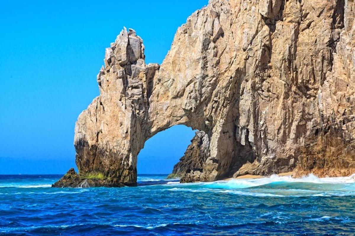 an arch in a rock formation in the ocean