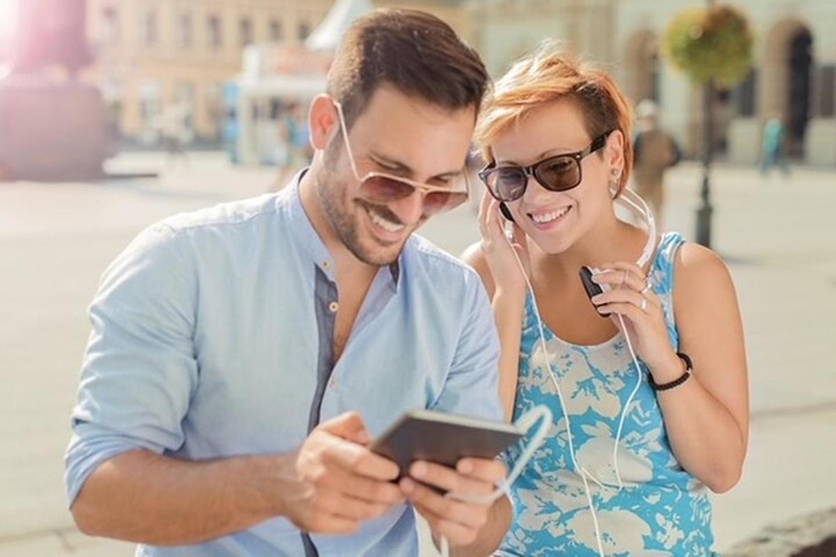 a man and a woman looking at a tablet computer