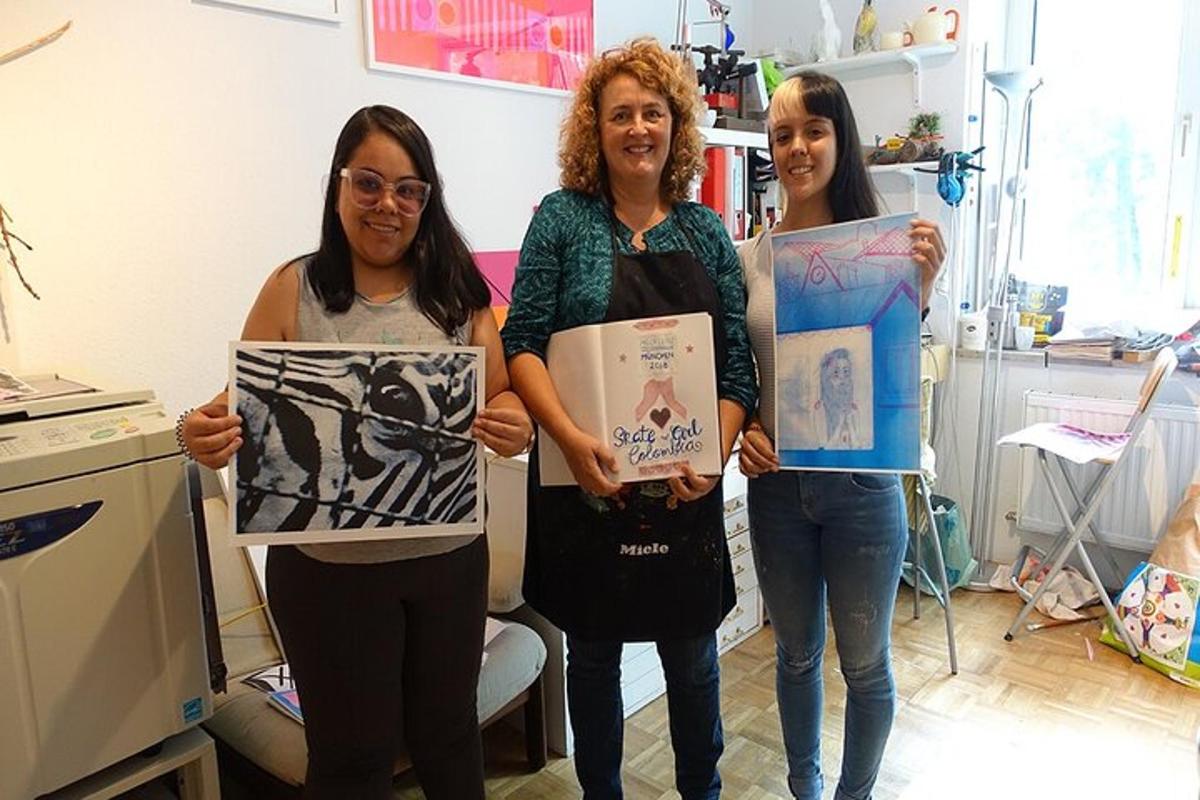 three women holding up signs in a room