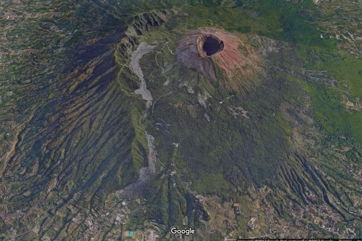 an aerial view of a mountain with a hole in it