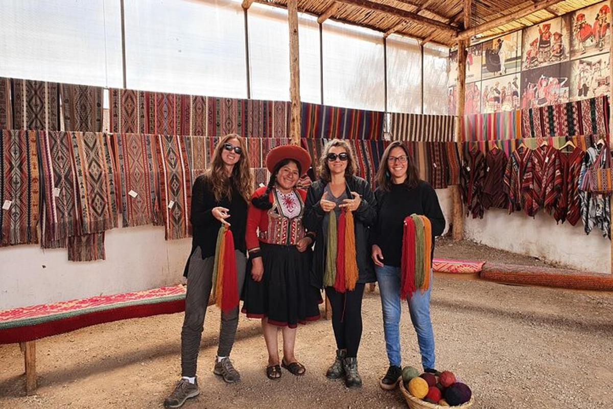 a group of women standing in front of a painting