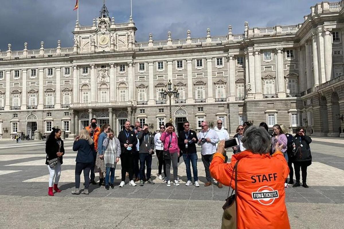 a group of people standing in front of a large building