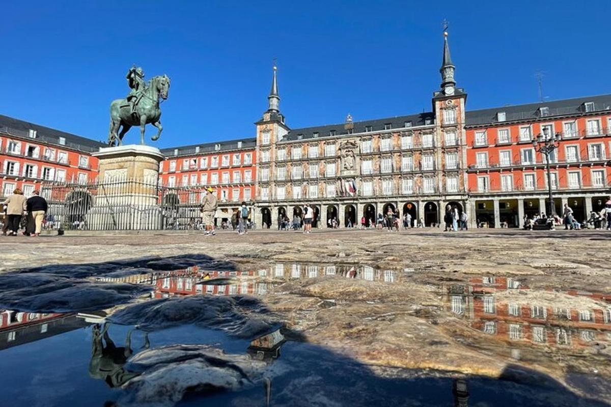 a large building with a statue in front of it