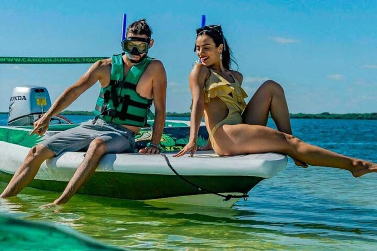 a man and woman sitting on a boat in the water