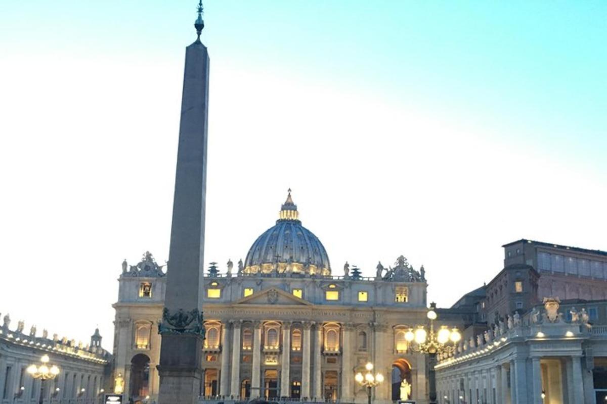 a large building with a monument in front of it