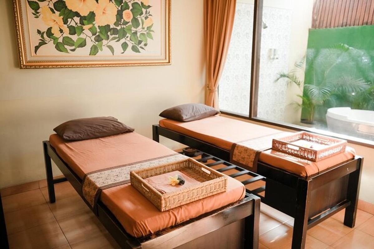 two twin beds in a room with a window