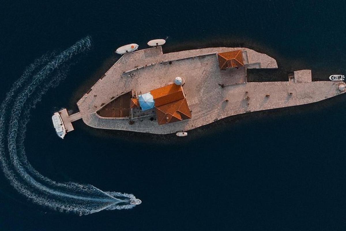 an aerial view of a boat in the water