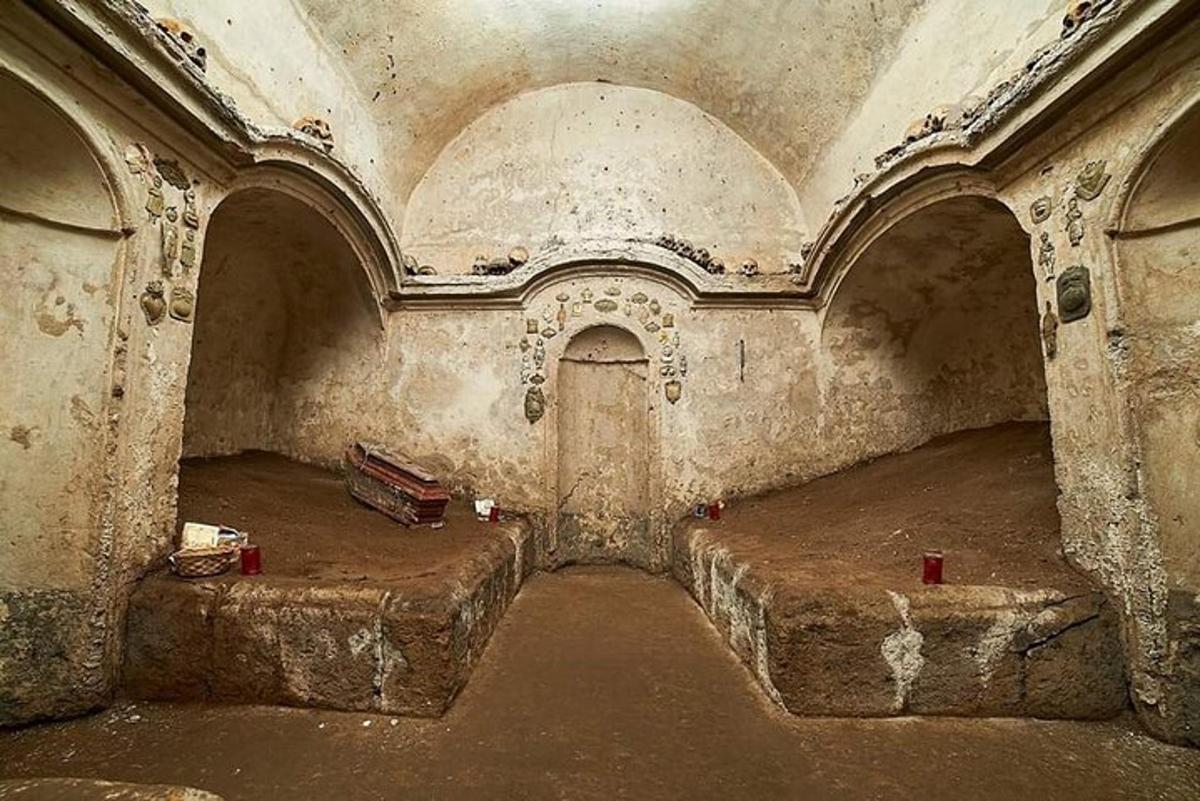 a room with two beds in an old building