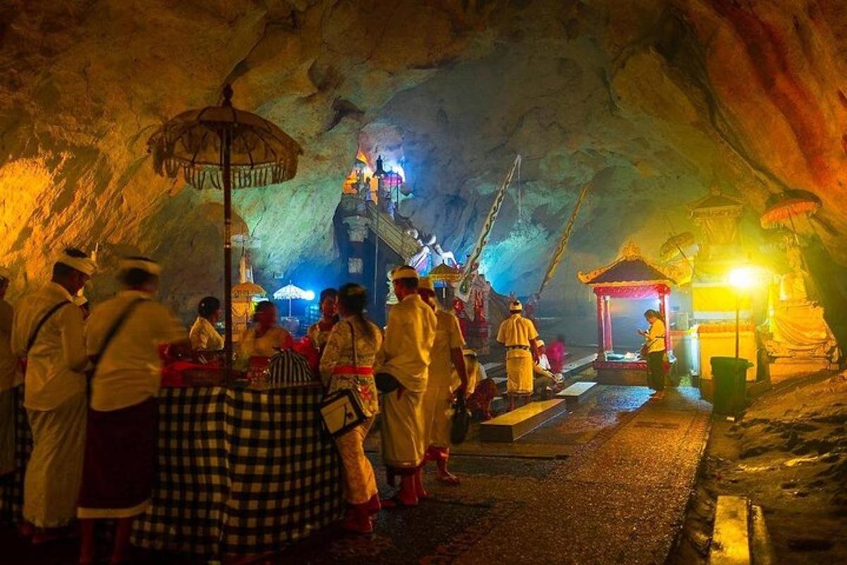 a group of people standing in a cave