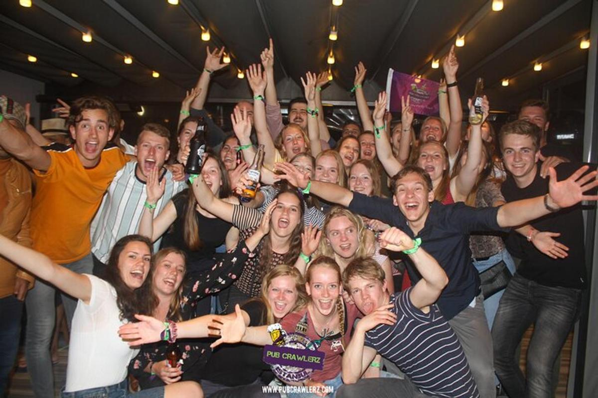 a group of people raising their hands in the air