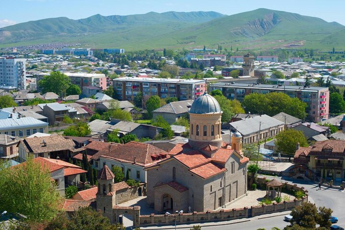 an aerial view of a small town with a church