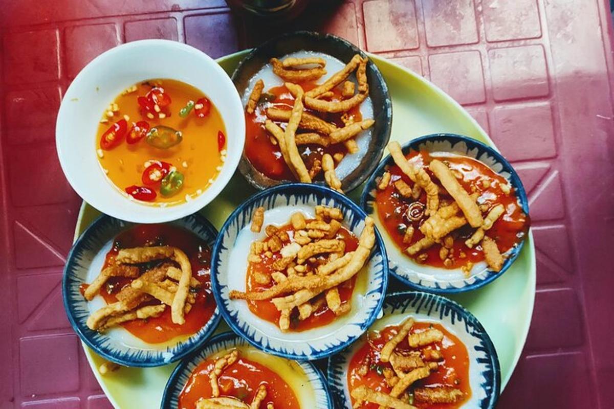 a plate of food with appetizers and a bowl of soup
