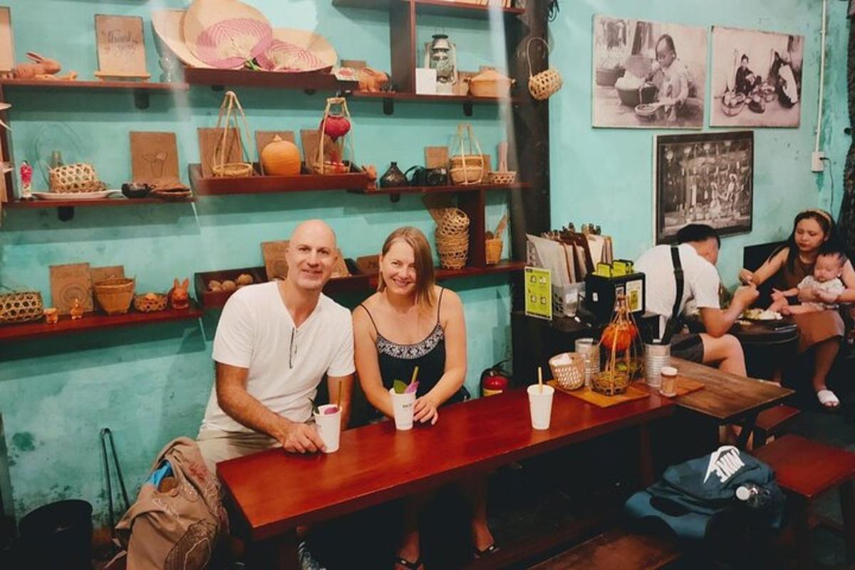 a man and woman sitting at a table in a restaurant