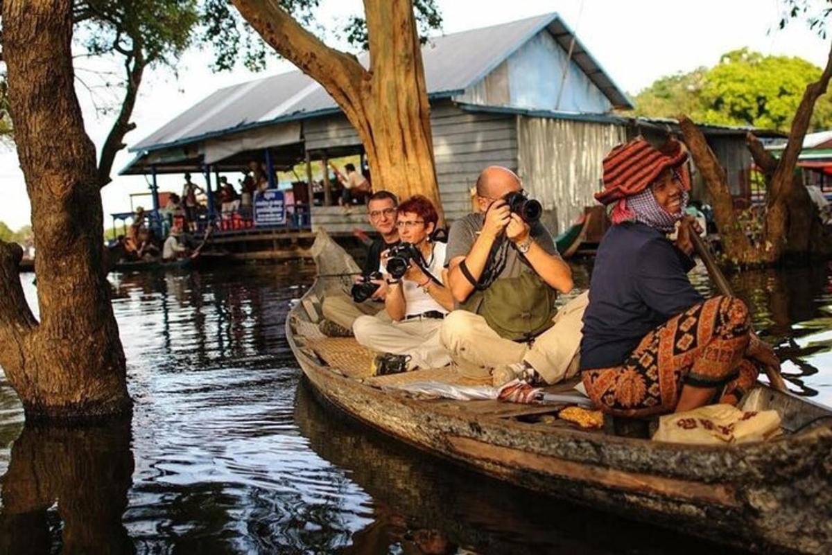 a group of people in a boat on the water