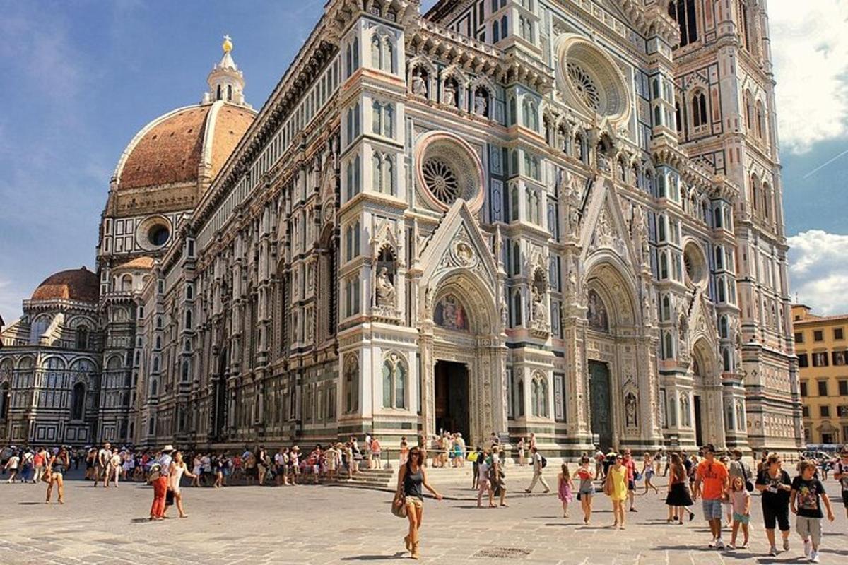 a group of people standing in front of a cathedral