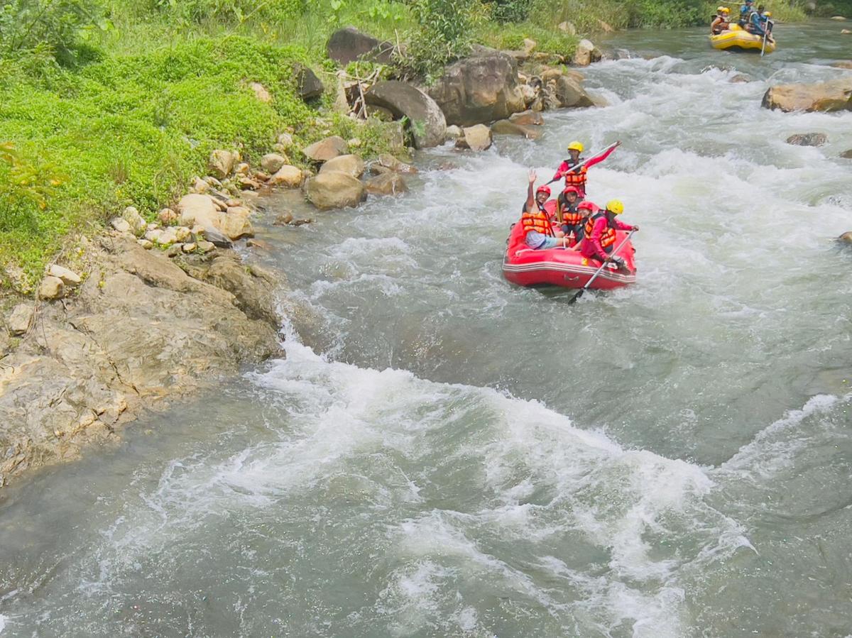 a group of people in a raft in a river