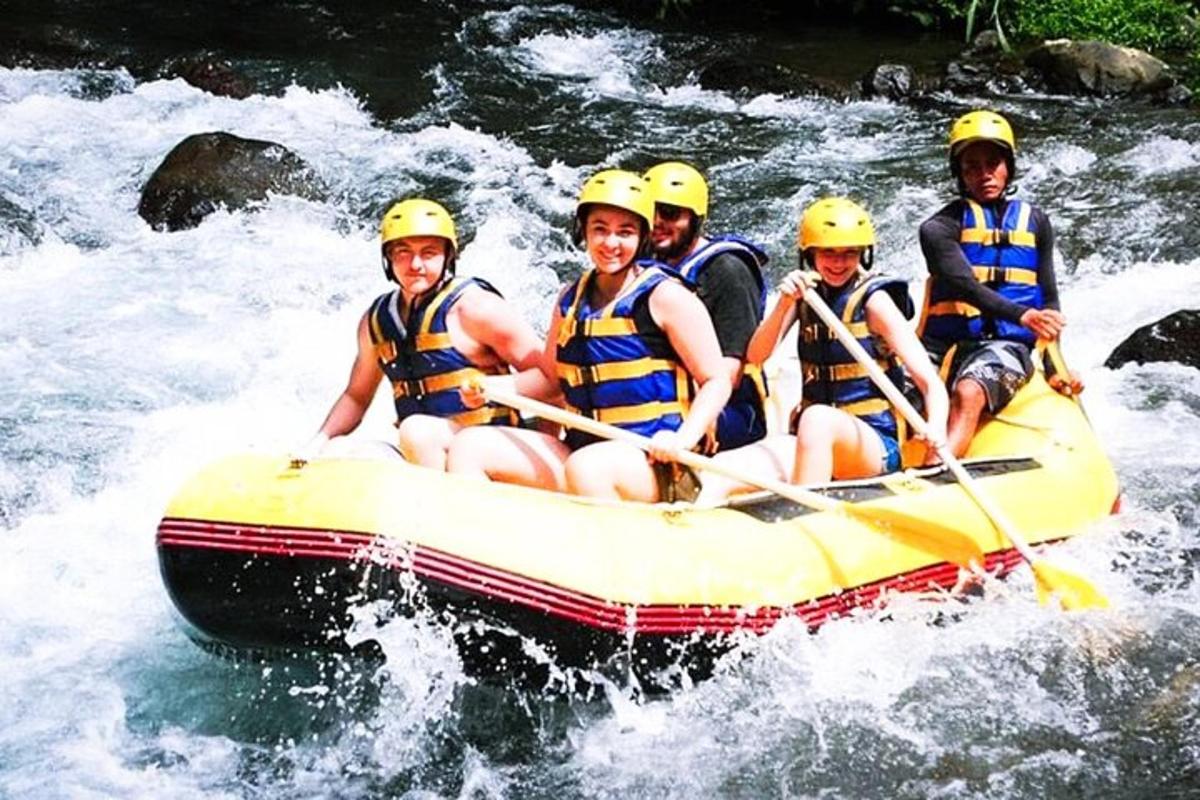 a group of people in a raft on a river