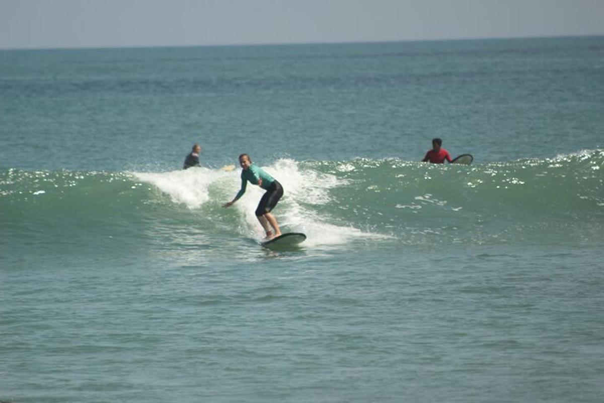 a person riding a wave on a surfboard in the ocean