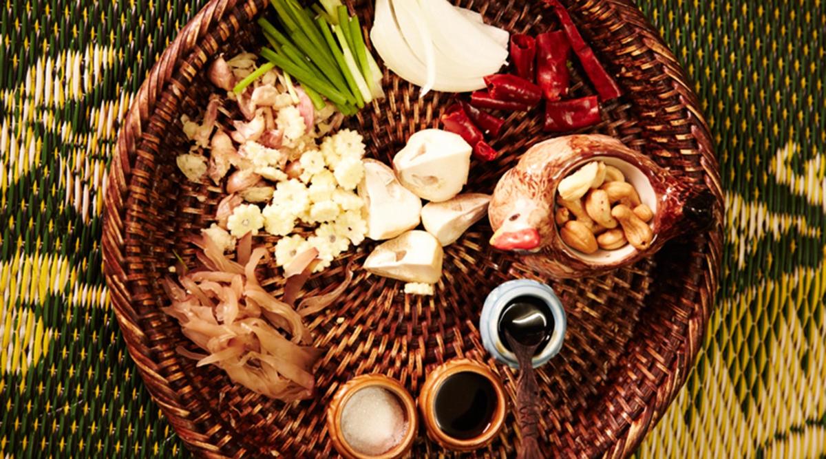 a wicker basket filled with different types of food
