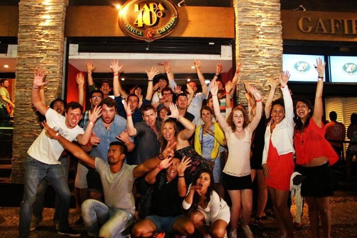 a group of people with their hands in the air